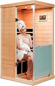 A woman relaxing inside the best 1 one person sauna, showcasing its modern wooden interior and serene, minimalist design.