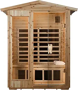 Wooden sauna with a clear glass door and side panels. Inside are a wooden bench, towel, and gentle lighting, creating a cozy and inviting atmosphere.