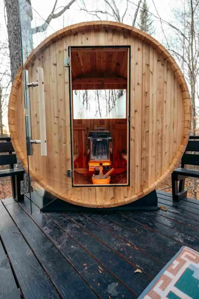 Outdoor sauna on a wooden deck, demonstrating how to use sauna for weight loss in a peaceful natural setting.