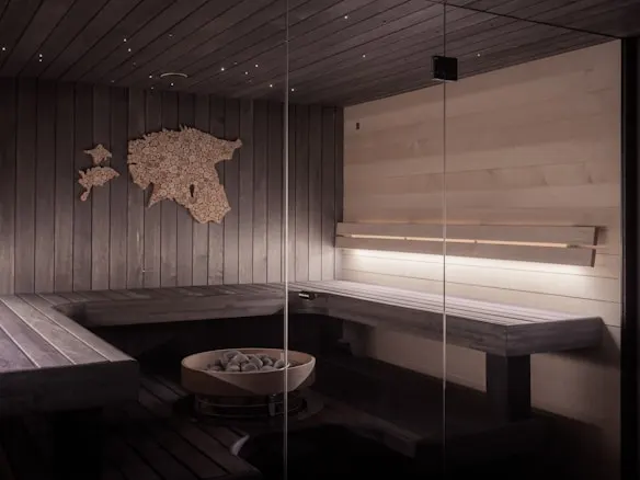 A sauna room with wooden walls and benches, set at the ideal temperature for infrared sauna therapy, offering a warm and relaxing atmosphere.